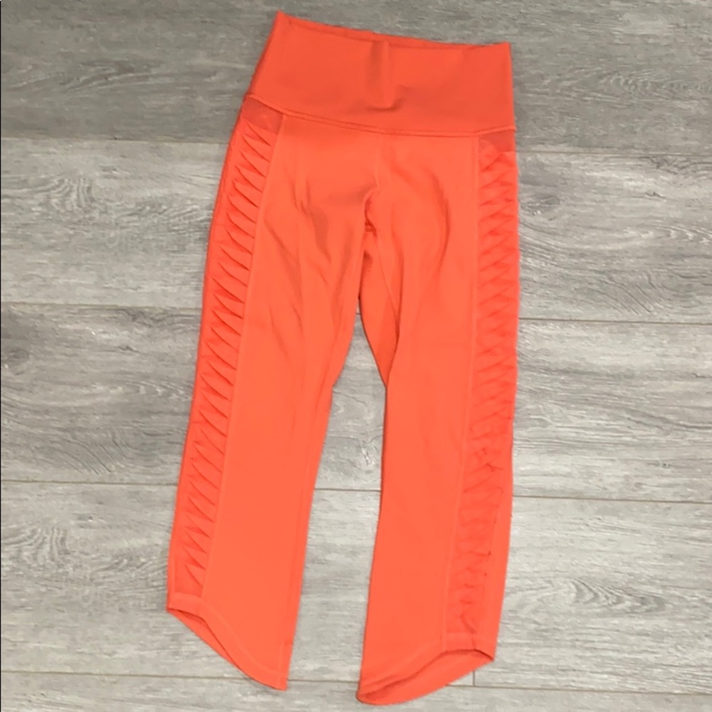 Orange cropped LuLulemon side mesh leggings